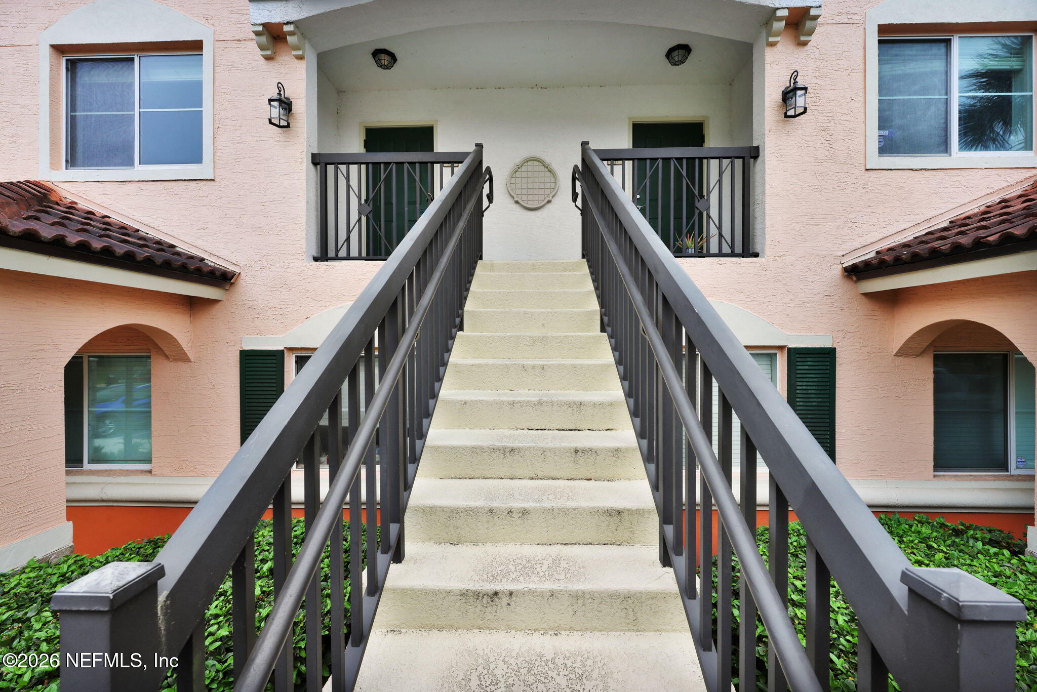 9745 Touchton Road, Unit 526 Jacksonville, FL 32246 - Photo 1 of 34 a view of staircase with lots of frames on wall and windows