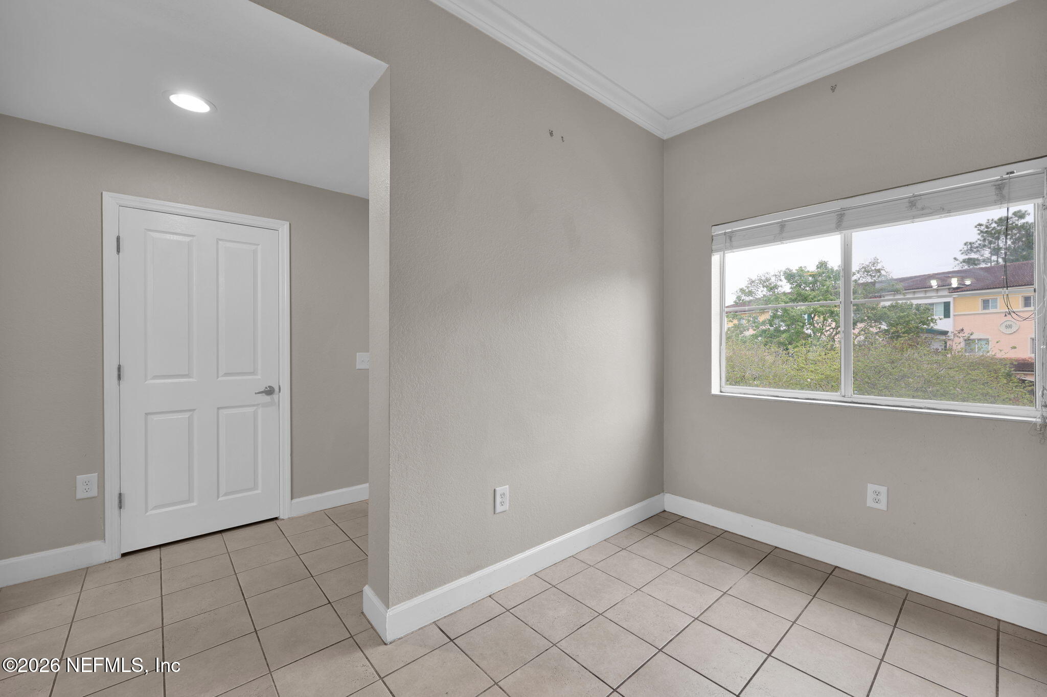 9745 Touchton Road, Unit 526 Jacksonville, FL 32246 - Photo 13 of 34 a view of an empty room with a window