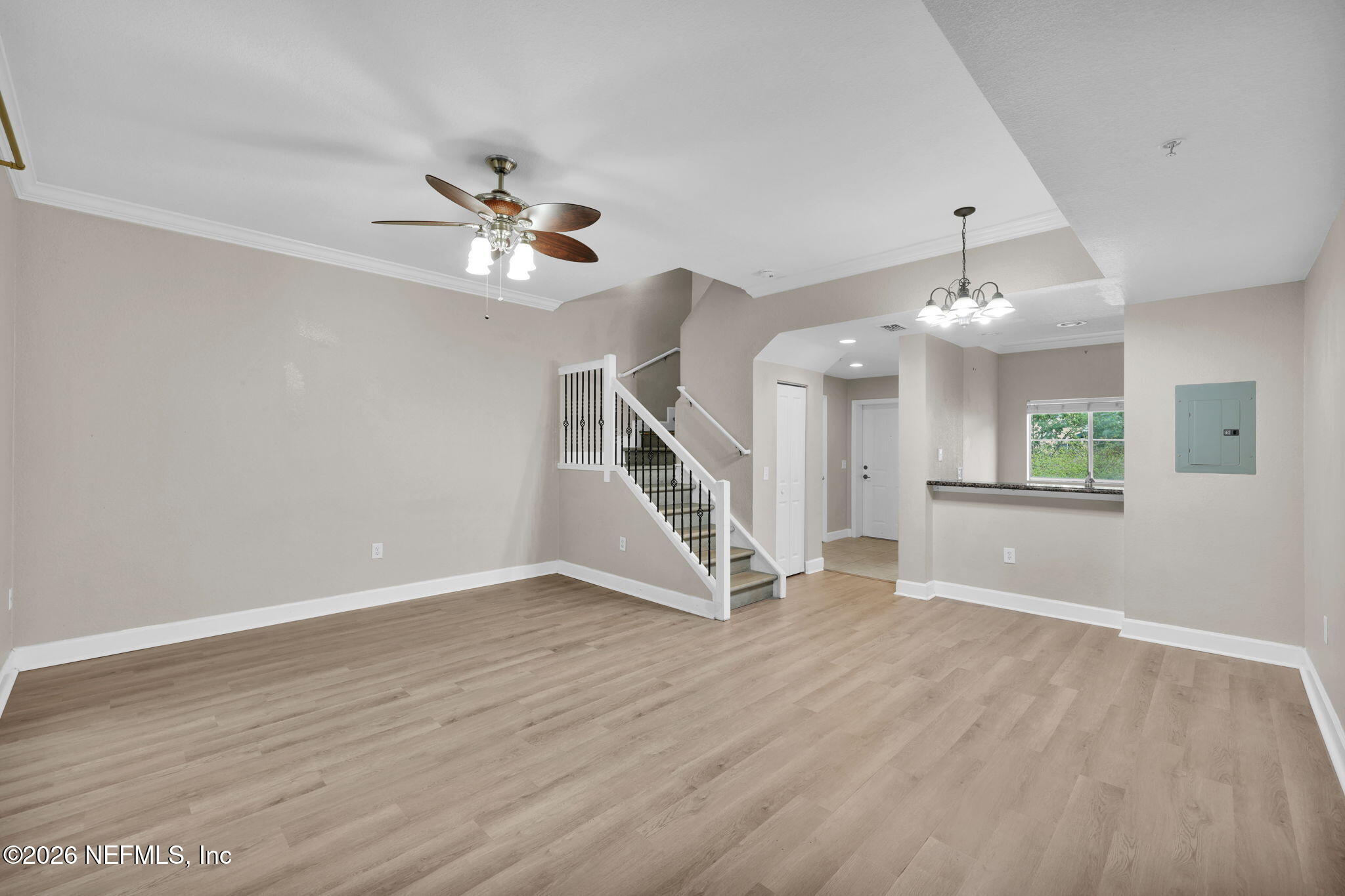 9745 Touchton Road, Unit 526 Jacksonville, FL 32246 - Photo 18 of 34 wooden floor in an empty room with a window