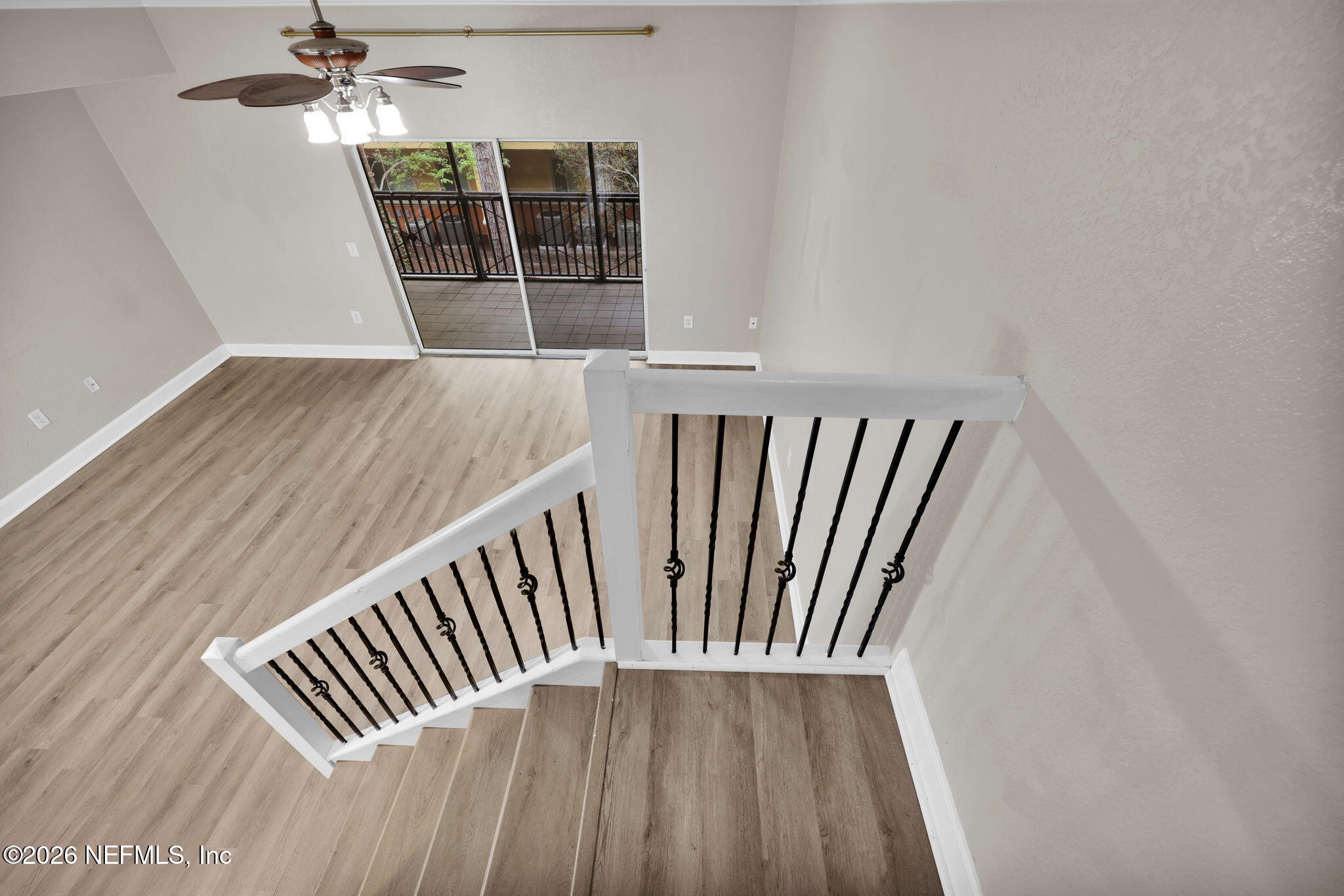9745 Touchton Road, Unit 526 Jacksonville, FL 32246 - Photo 21 of 34 wooden floor with staircase