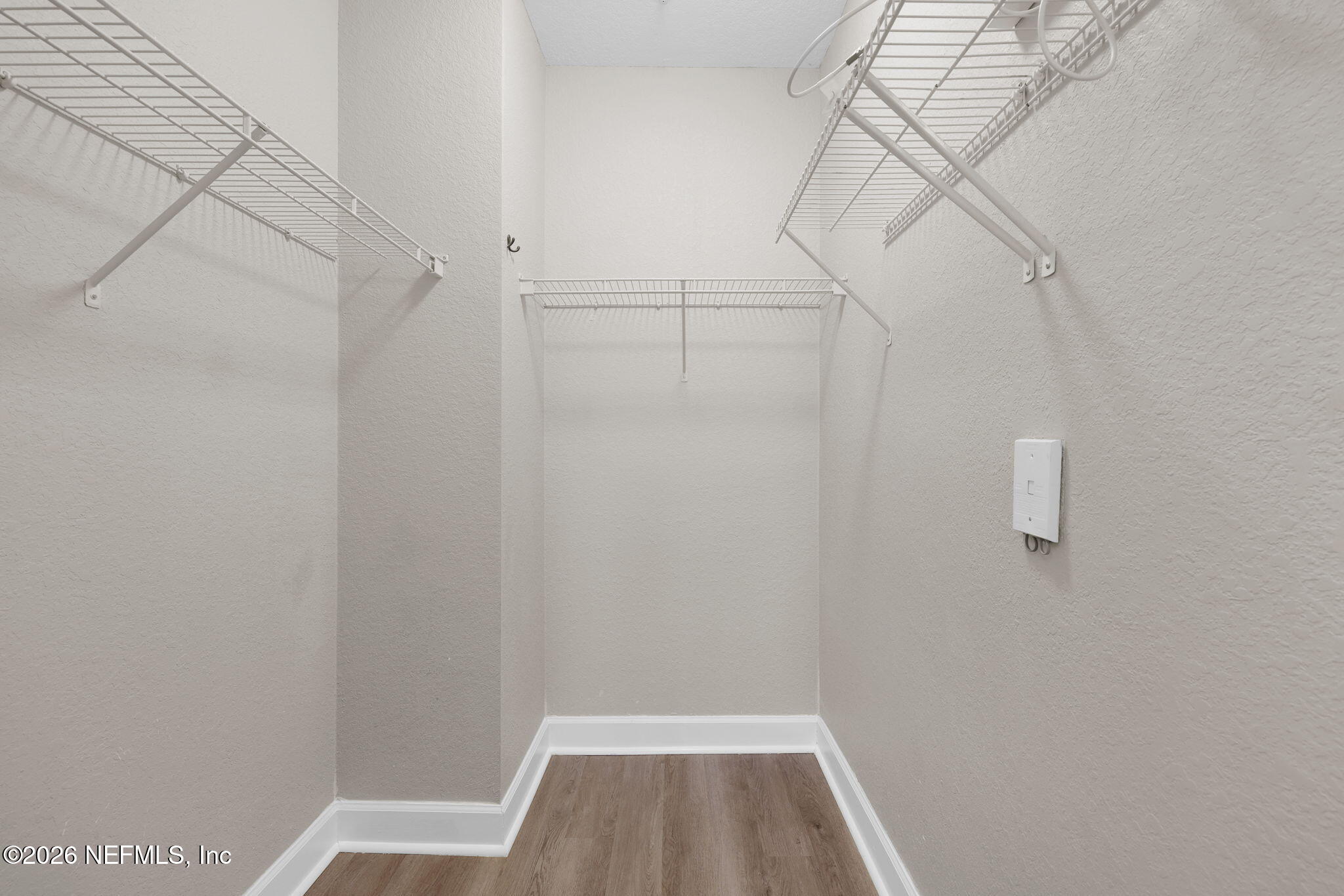 9745 Touchton Road, Unit 526 Jacksonville, FL 32246 - Photo 26 of 34 a view of a room with racks on the wall