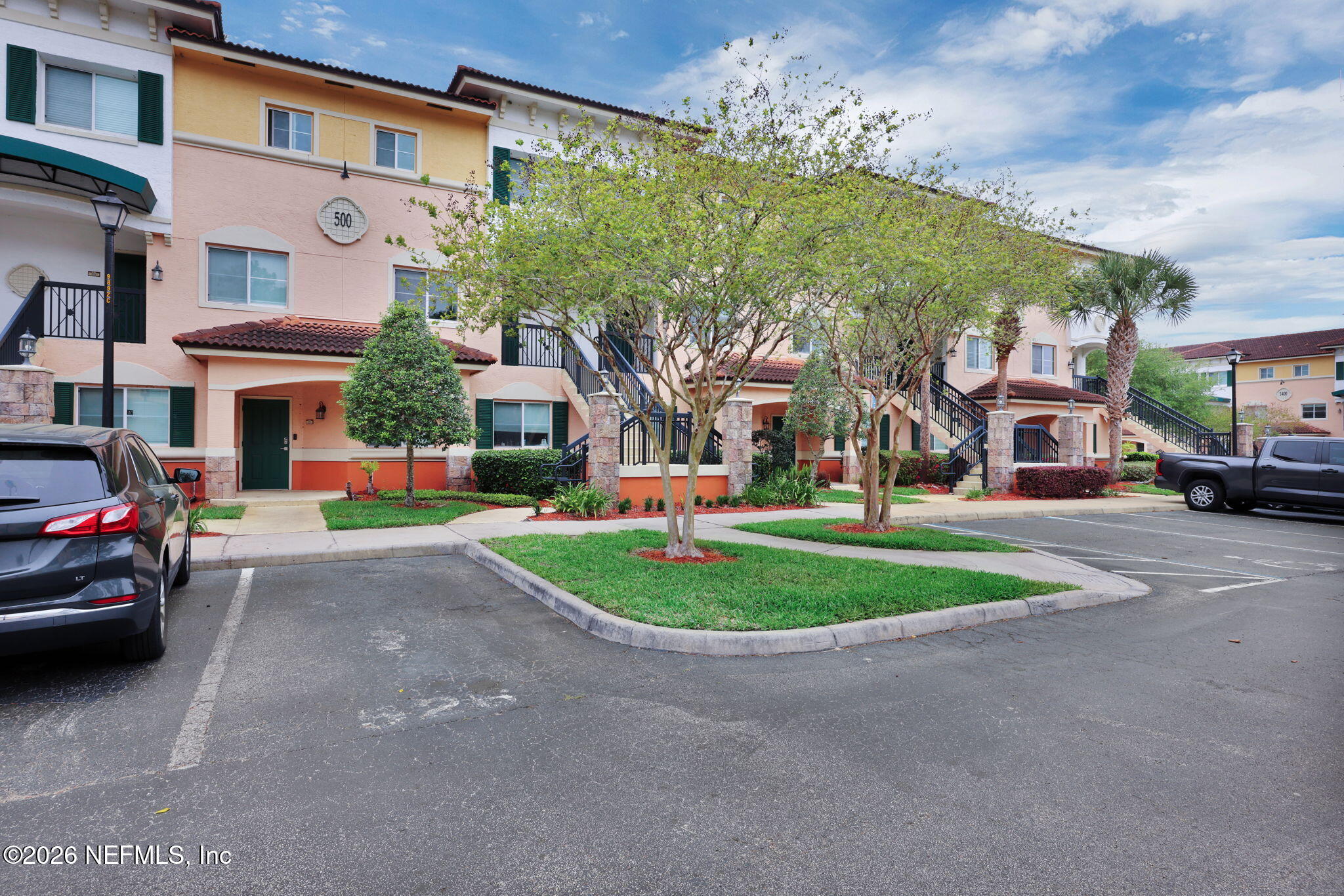 9745 Touchton Road, Unit 526 Jacksonville, FL 32246 - Photo 3 of 34 a view of multiple houses with a street