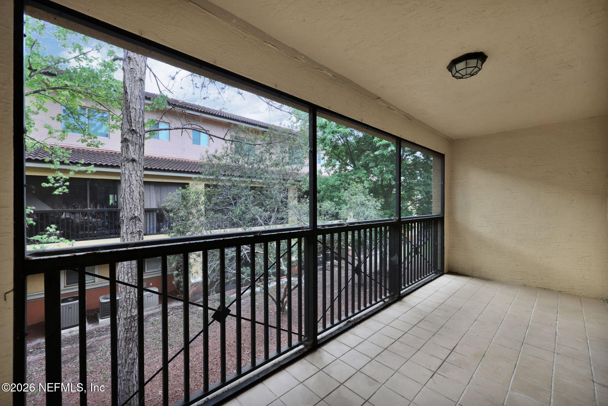 9745 Touchton Road, Unit 526 Jacksonville, FL 32246 - Photo 31 of 34 a view of a balcony with wooden floor