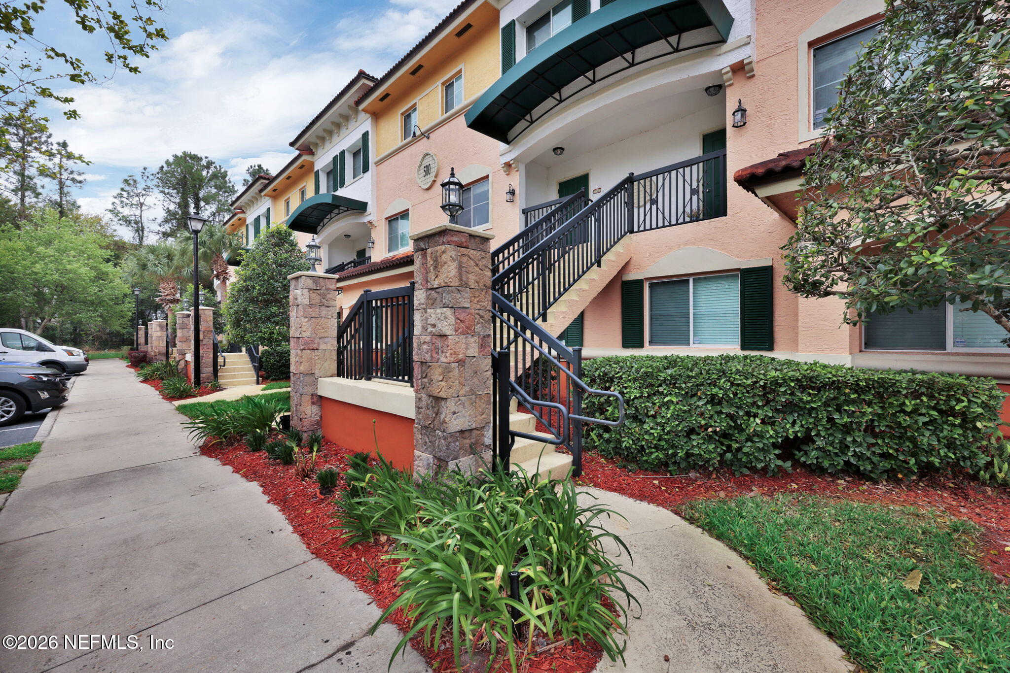9745 Touchton Road, Unit 526 Jacksonville, FL 32246 - Photo 6 of 34 front view of a house with a yard