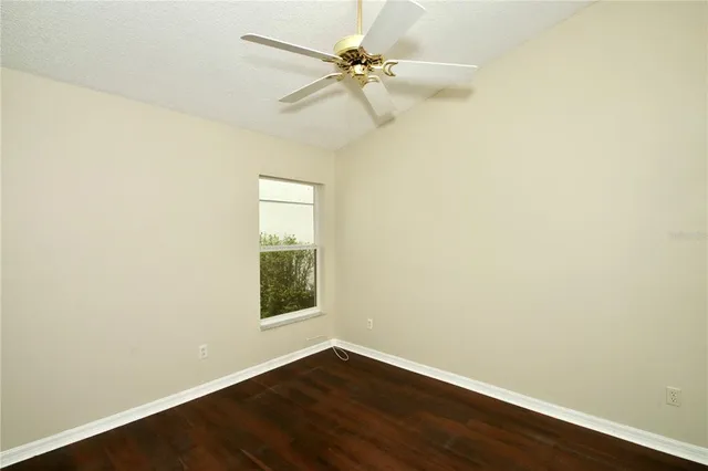 a view of a backyard with swimming pool