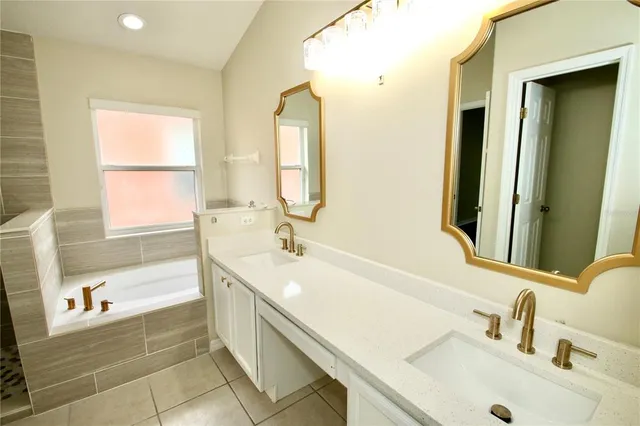 an aerial view of a house with garden space and lake view