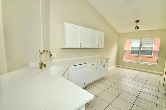 a white refrigerator freezer sitting inside of a kitchen