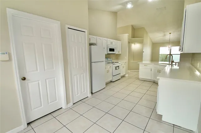 a view of a storage & utility room in a back yard