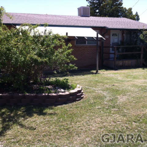236 29 Road Grand Junction, CO 81503 - Photo 1 of 9 a couple of table and chairs in front of house