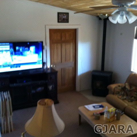 236 29 Road Grand Junction, CO 81503 - Photo 9 of 9 a living room with furniture and a flat screen tv
