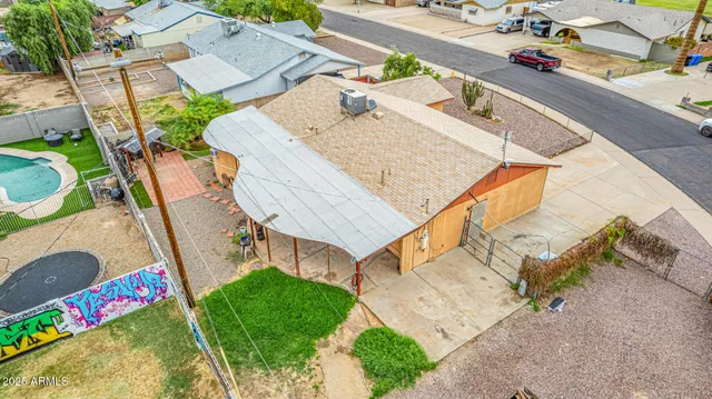 an aerial view of a house with swimming pool