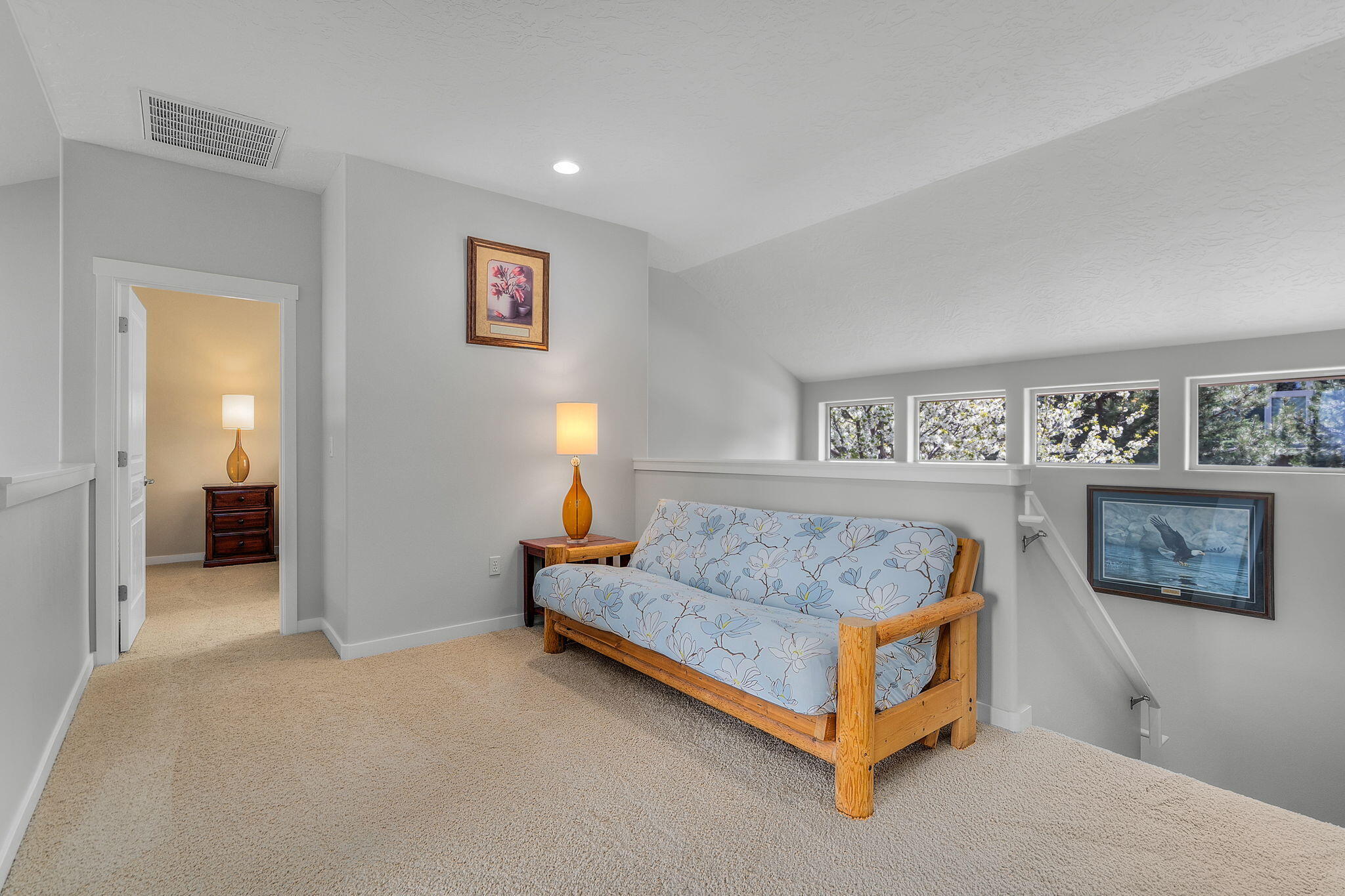 10870 Village Loop Redmond, OR 97756 - Photo 16 of 35 a living room with furniture and a wall painting