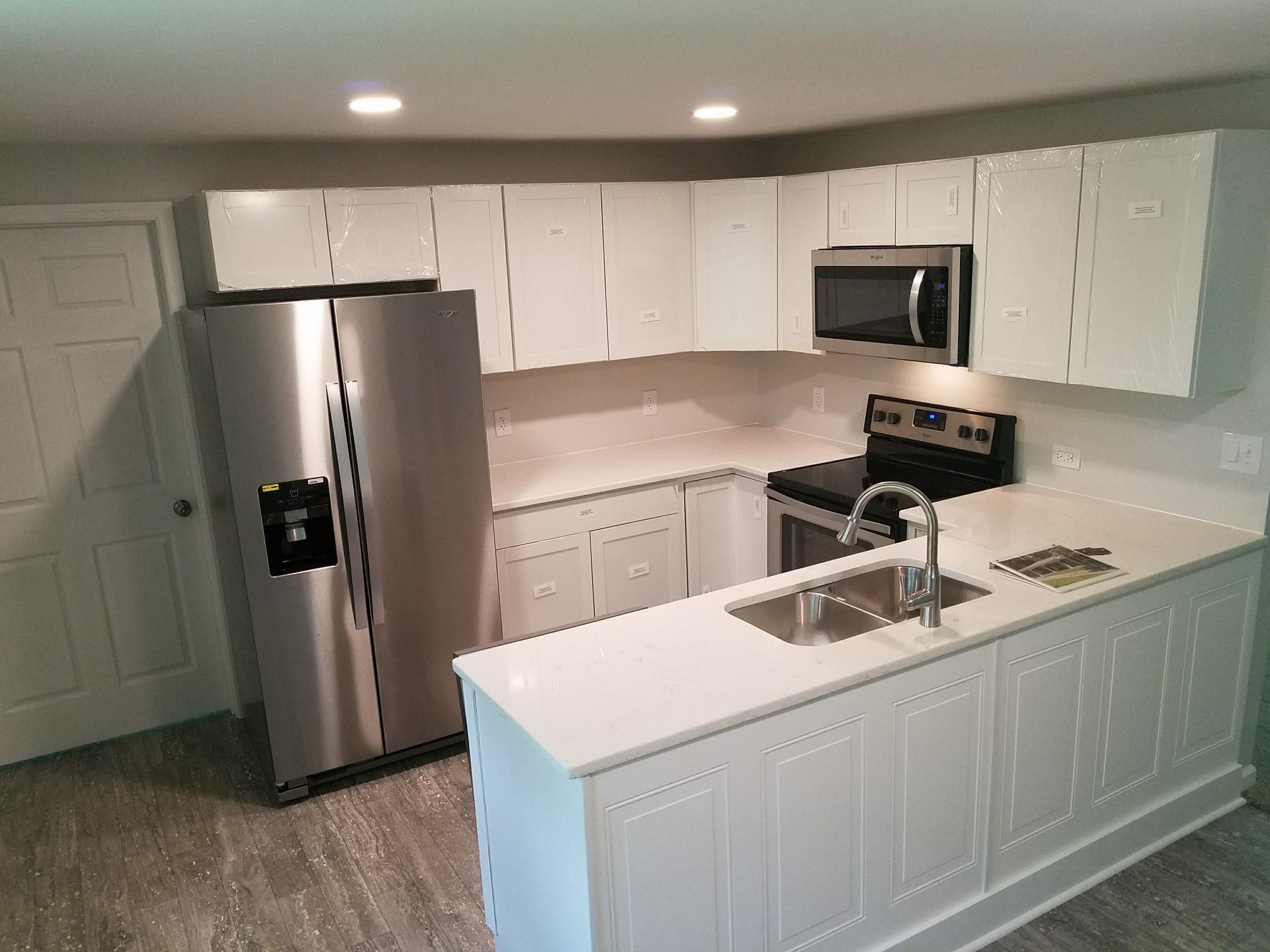 480 Eno Road Dickson, TN 37055 - Photo 2 of 14 a kitchen with appliances a sink and cabinets