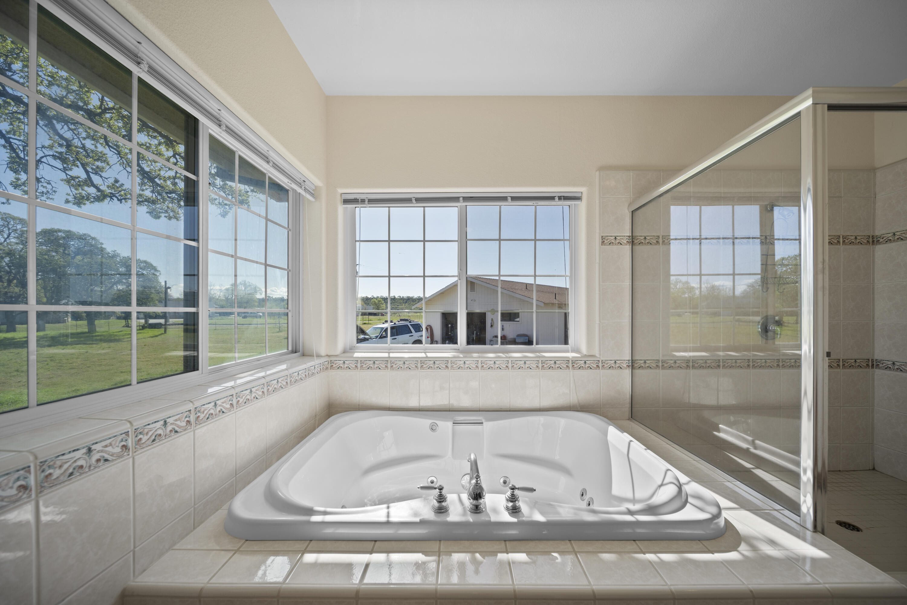 17935 Rivers Edge Drive Red Bluff, CA 96080 - Photo 20 of 38 a white bath tub sitting next to a window