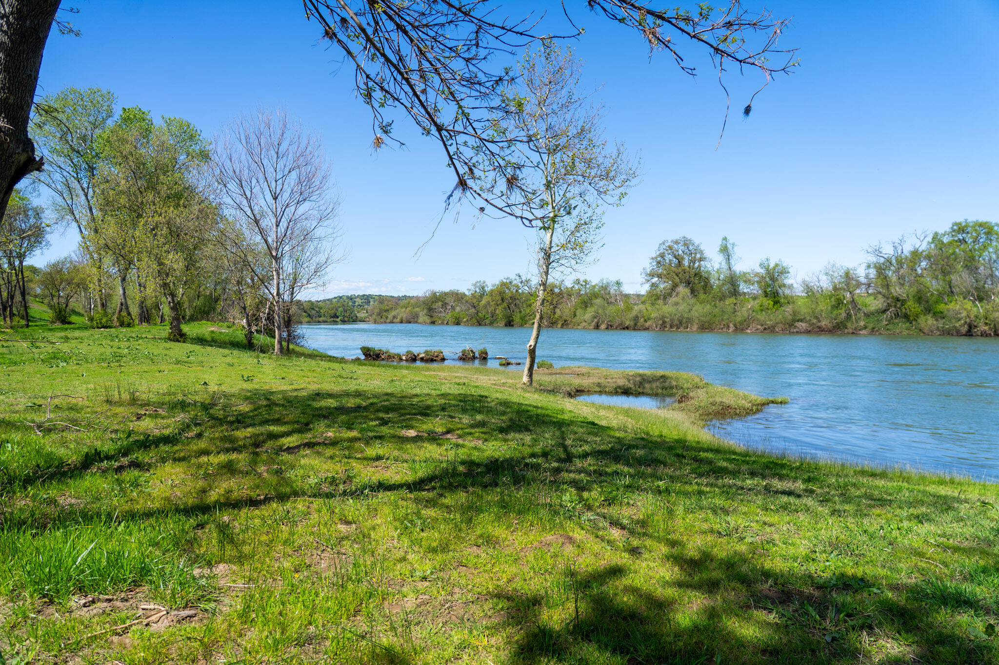 17935 Rivers Edge Drive Red Bluff, CA 96080 - Photo 2 of 38 a view of a lake with houses in the background