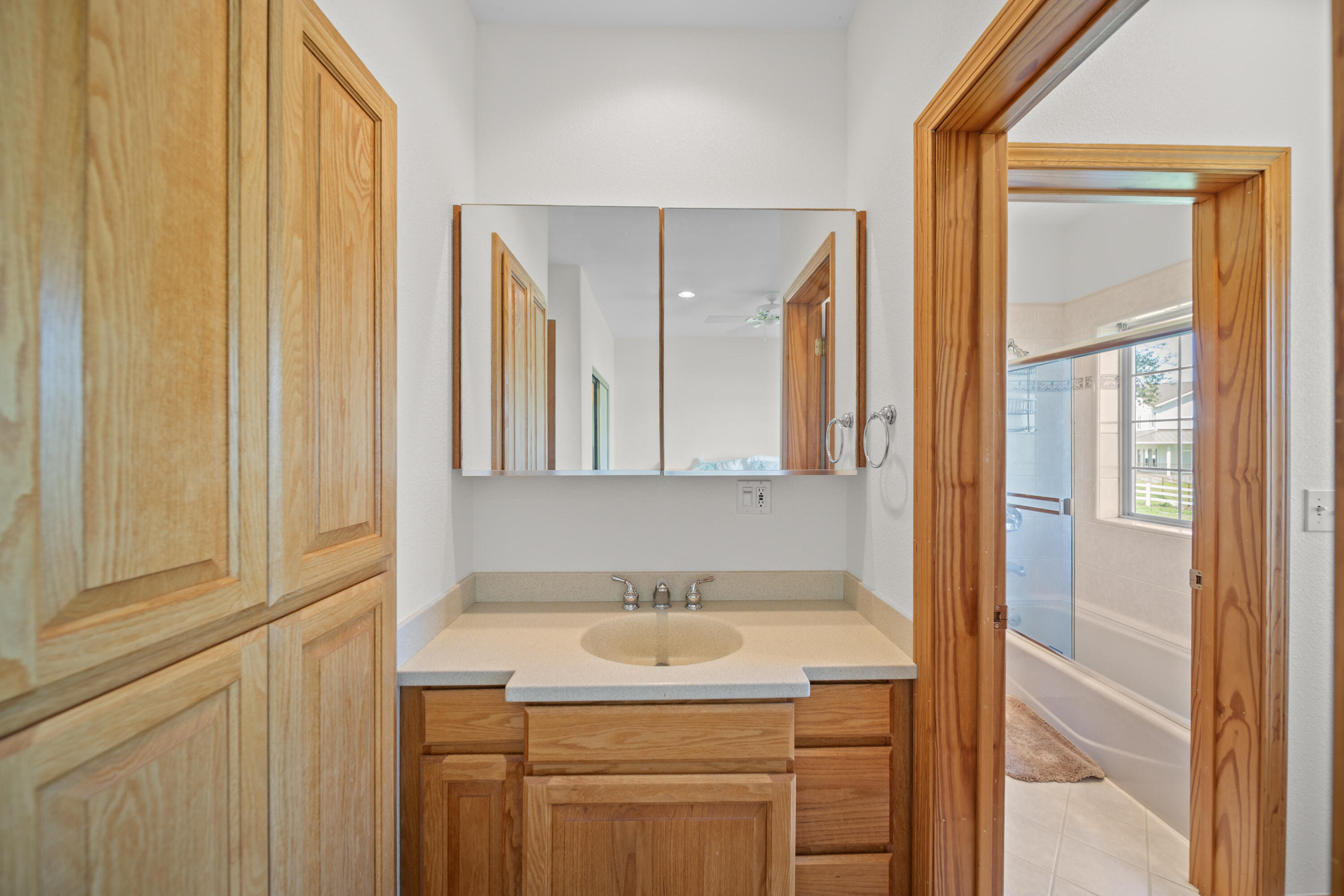 17935 Rivers Edge Drive Red Bluff, CA 96080 - Photo 21 of 38 a bathroom with a granite countertop sink and a mirror
