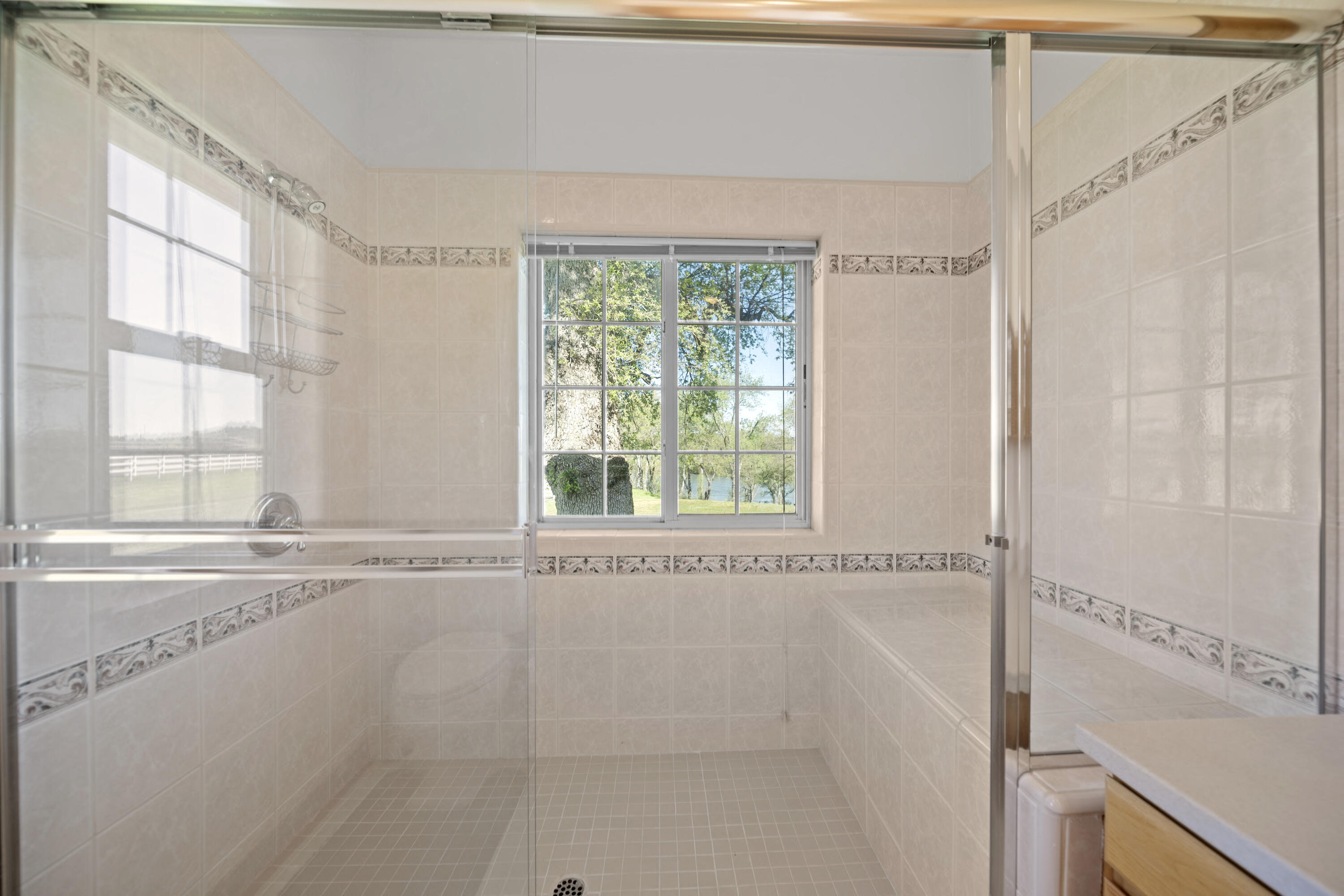 17935 Rivers Edge Drive Red Bluff, CA 96080 - Photo 24 of 38 a bathroom with a bathtub and a window