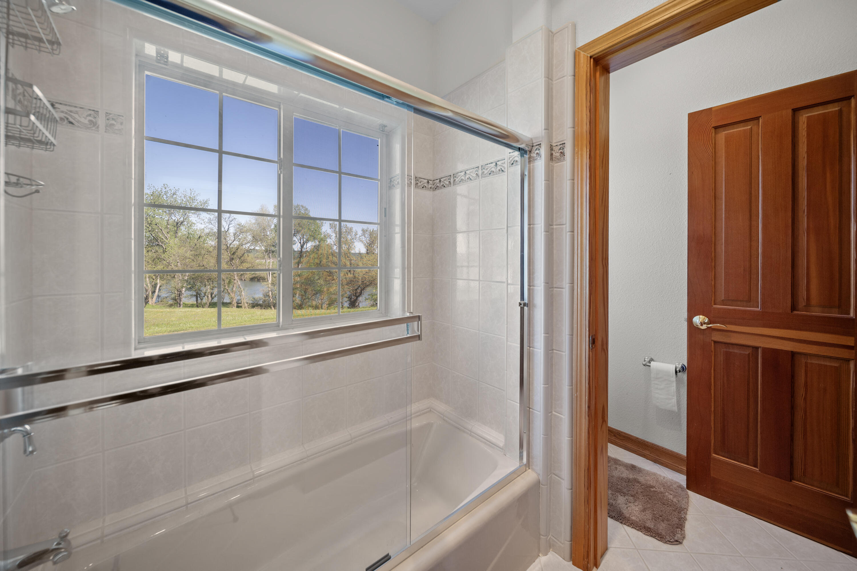 17935 Rivers Edge Drive Red Bluff, CA 96080 - Photo 27 of 38 a bathroom with a bathtub and a shower