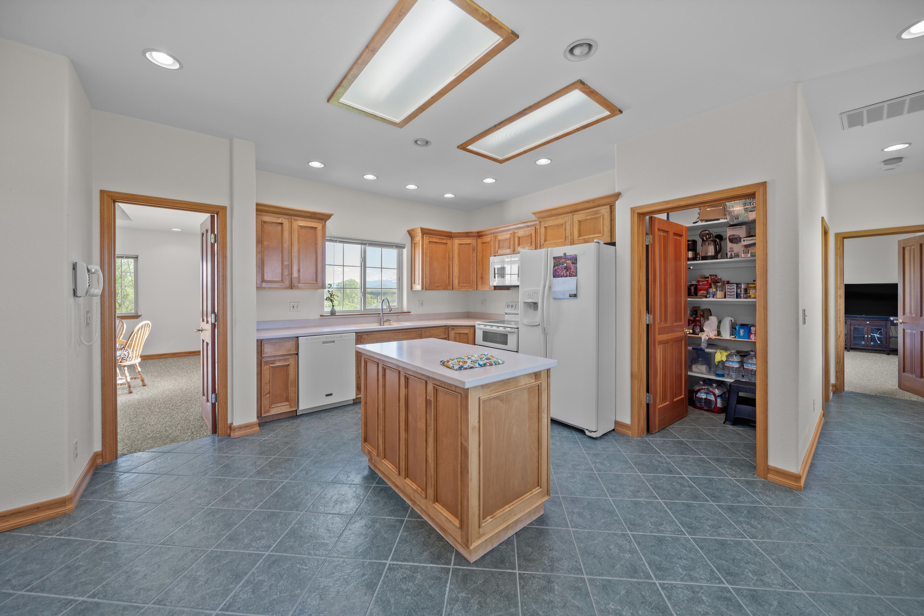 17935 Rivers Edge Drive Red Bluff, CA 96080 - Photo 33 of 38 a kitchen with a refrigerator and a sink