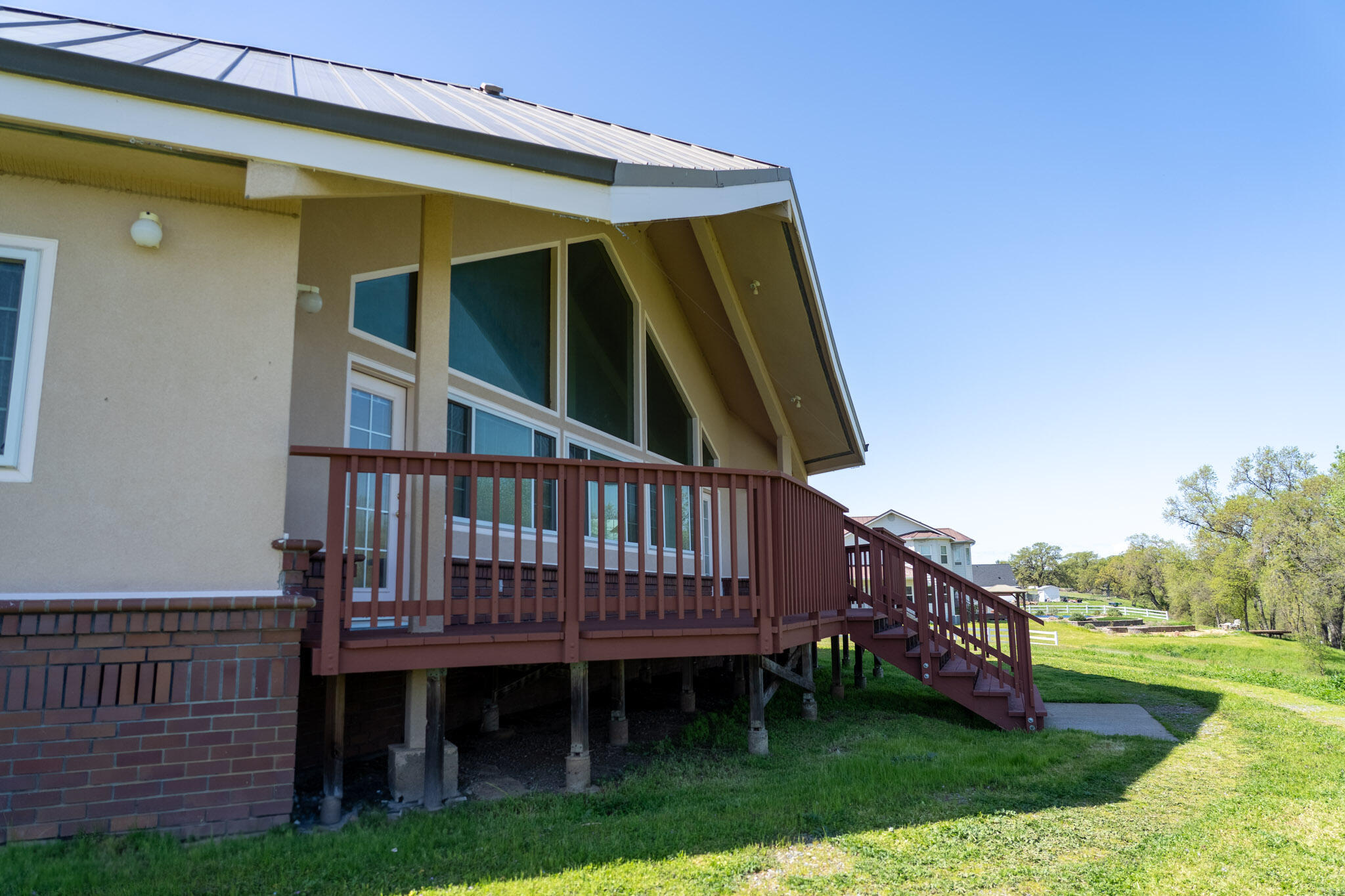 17935 Rivers Edge Drive Red Bluff, CA 96080 - Photo 36 of 38 a view of a house with wooden deck and furniture