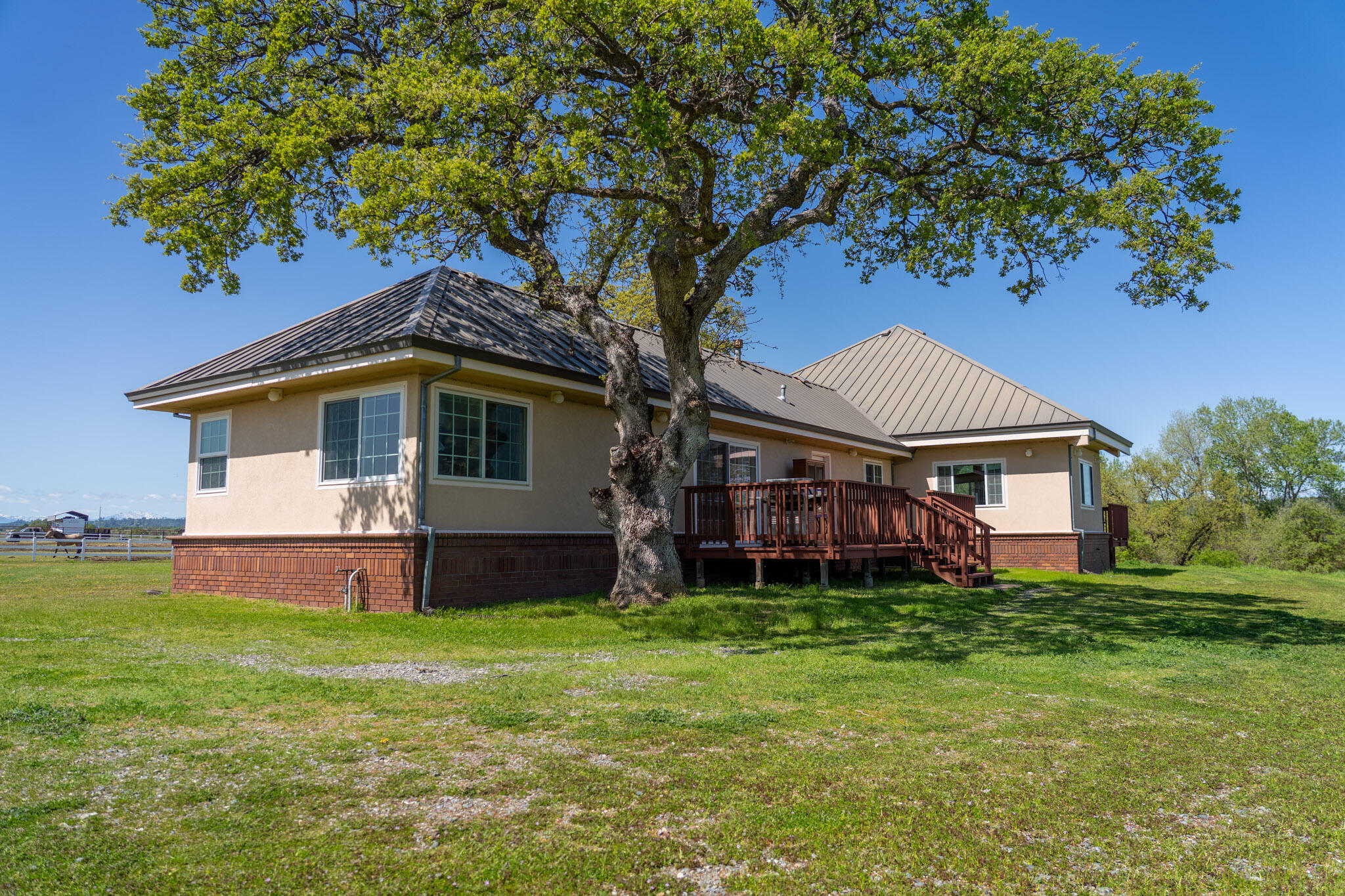 17935 Rivers Edge Drive Red Bluff, CA 96080 - Photo 10 of 38 a front view of a house with a garden and yard