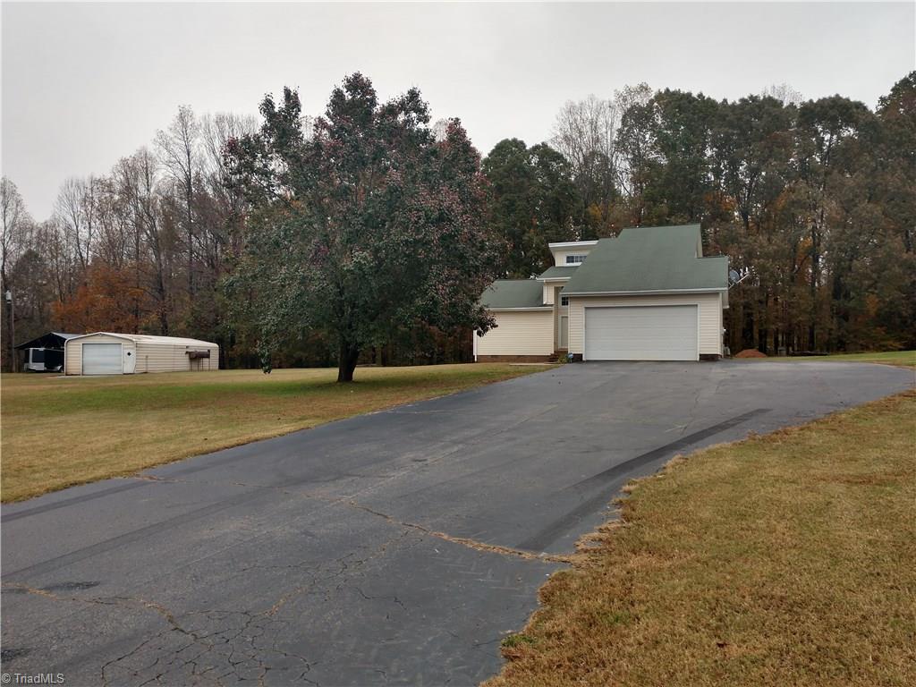 191 Copperhead Road Reidsville, NC 27320 - Photo 2 of 30 Front View of home with lots of parking and a paved driveway
