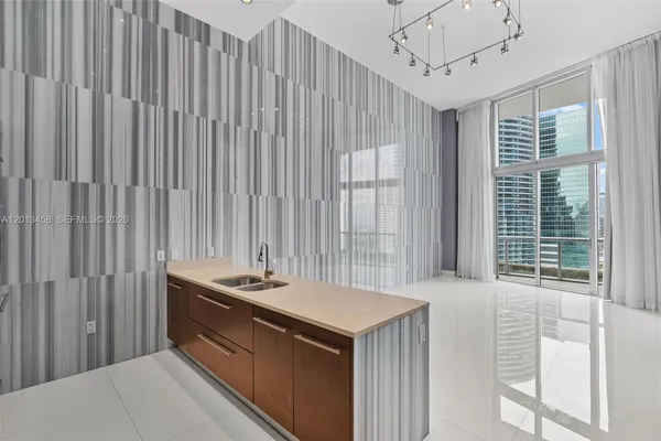 a kitchen with a sink and a window