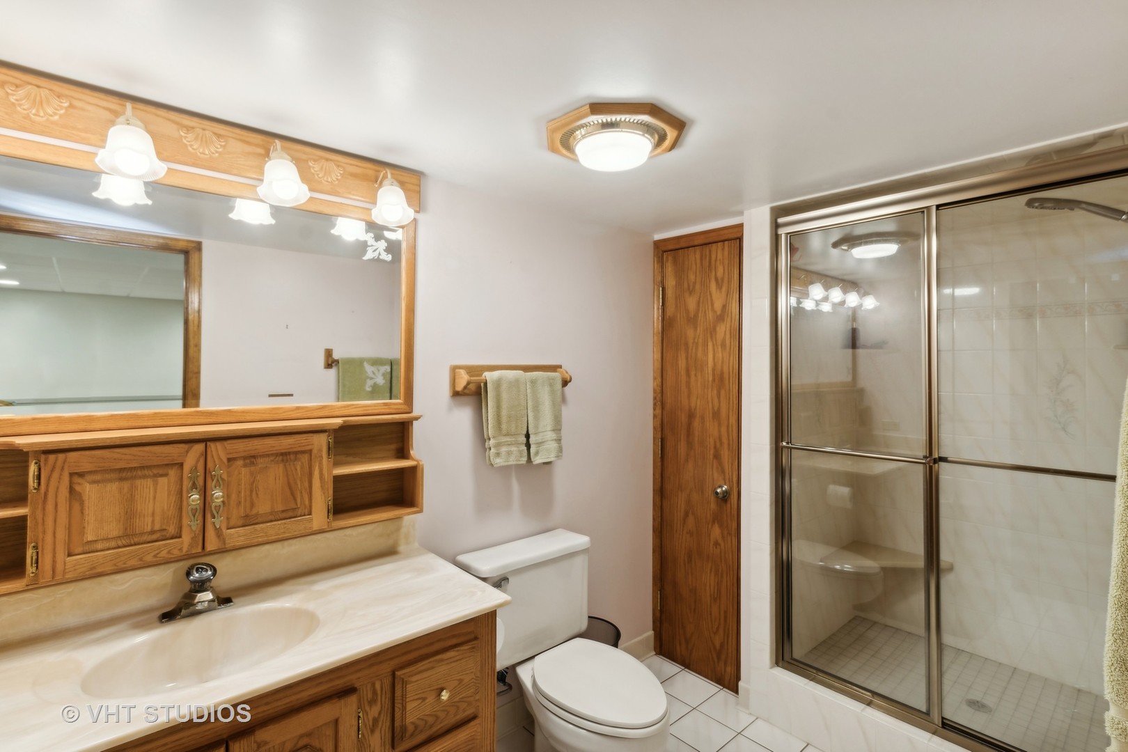 236 Foxmoor Road Fox River Grove, IL 60021 - Photo 20 of 28 a bathroom with a sink a toilet a mirror and shower
