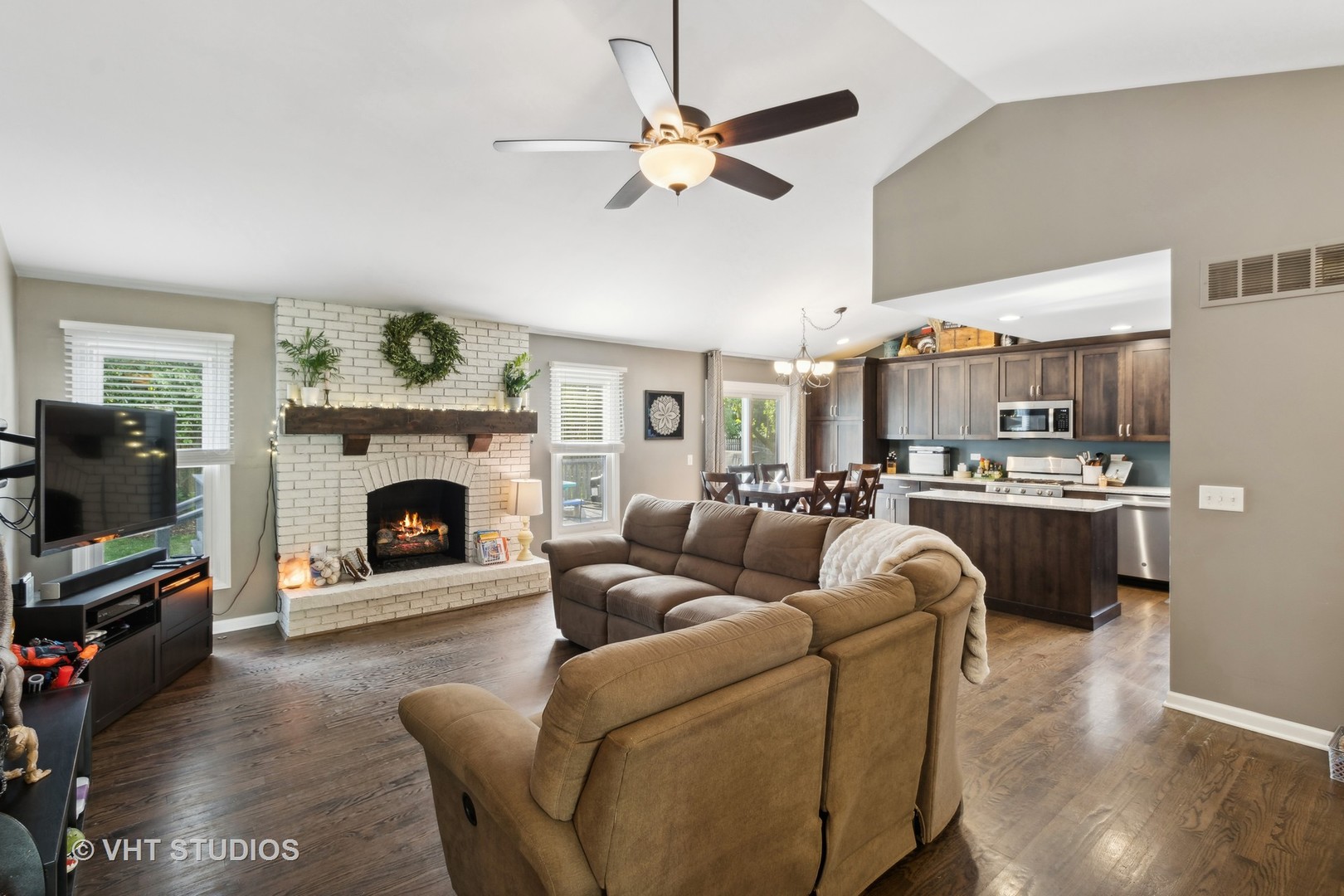 236 Foxmoor Road Fox River Grove, IL 60021 - Photo 2 of 28 a living room with furniture a fireplace and a flat screen tv