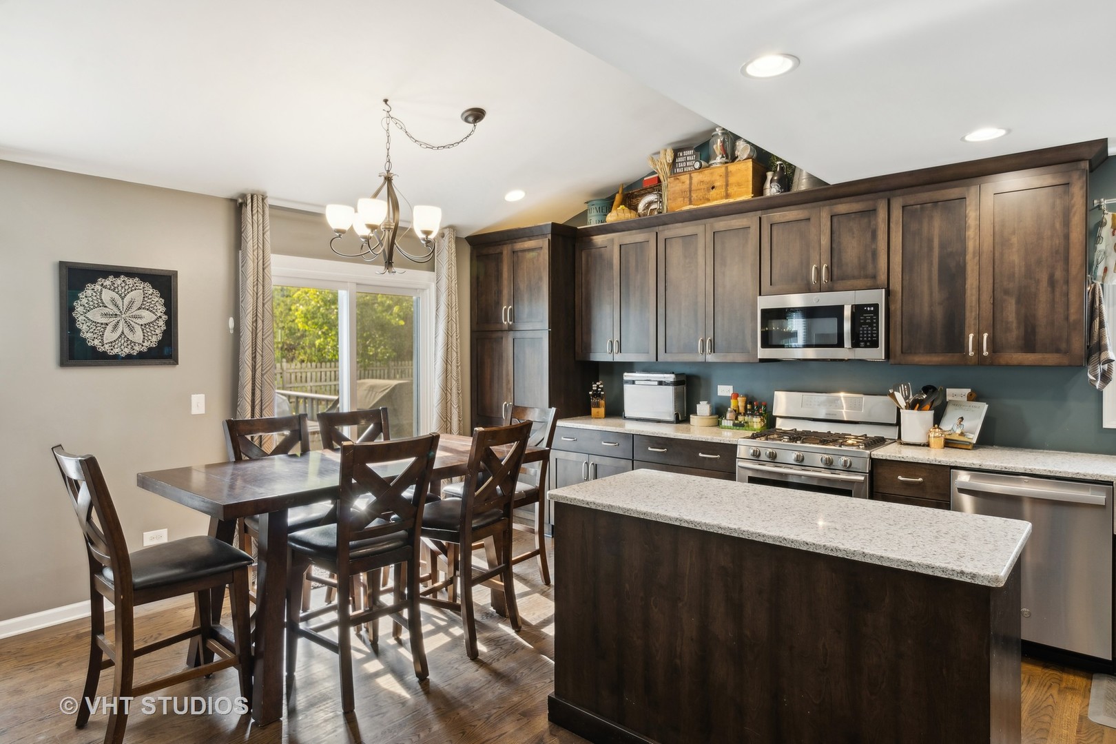 236 Foxmoor Road Fox River Grove, IL 60021 - Photo 5 of 28 a kitchen with granite countertop a table chairs microwave and cabinets