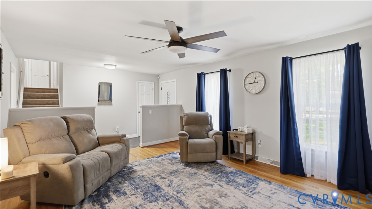 11430 Marsden Road Chester, VA 23831 - Photo 6 of 33 Open living area featuring wood-finish flooring, a