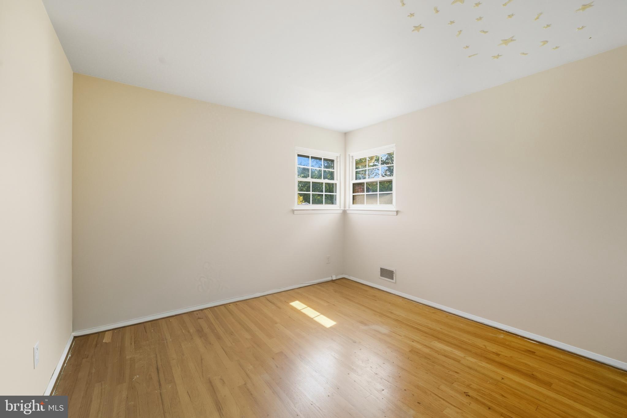 5 Corey Drive Ewing, NJ 08618 - Photo 19 of 30 an empty room with wooden floor and windows