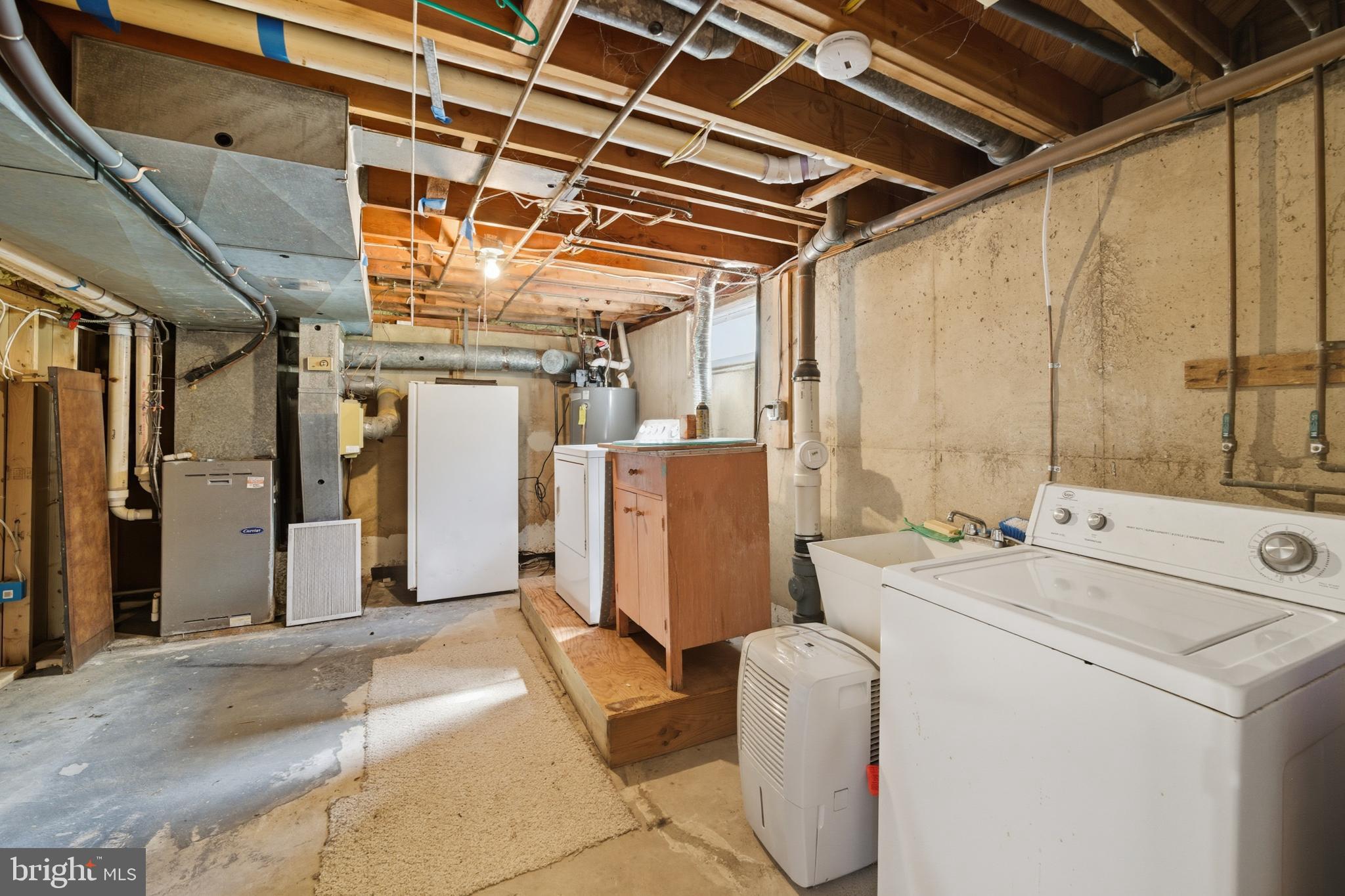 5 Corey Drive Ewing, NJ 08618 - Photo 27 of 30 a view of storage and utility room with washer and dryer