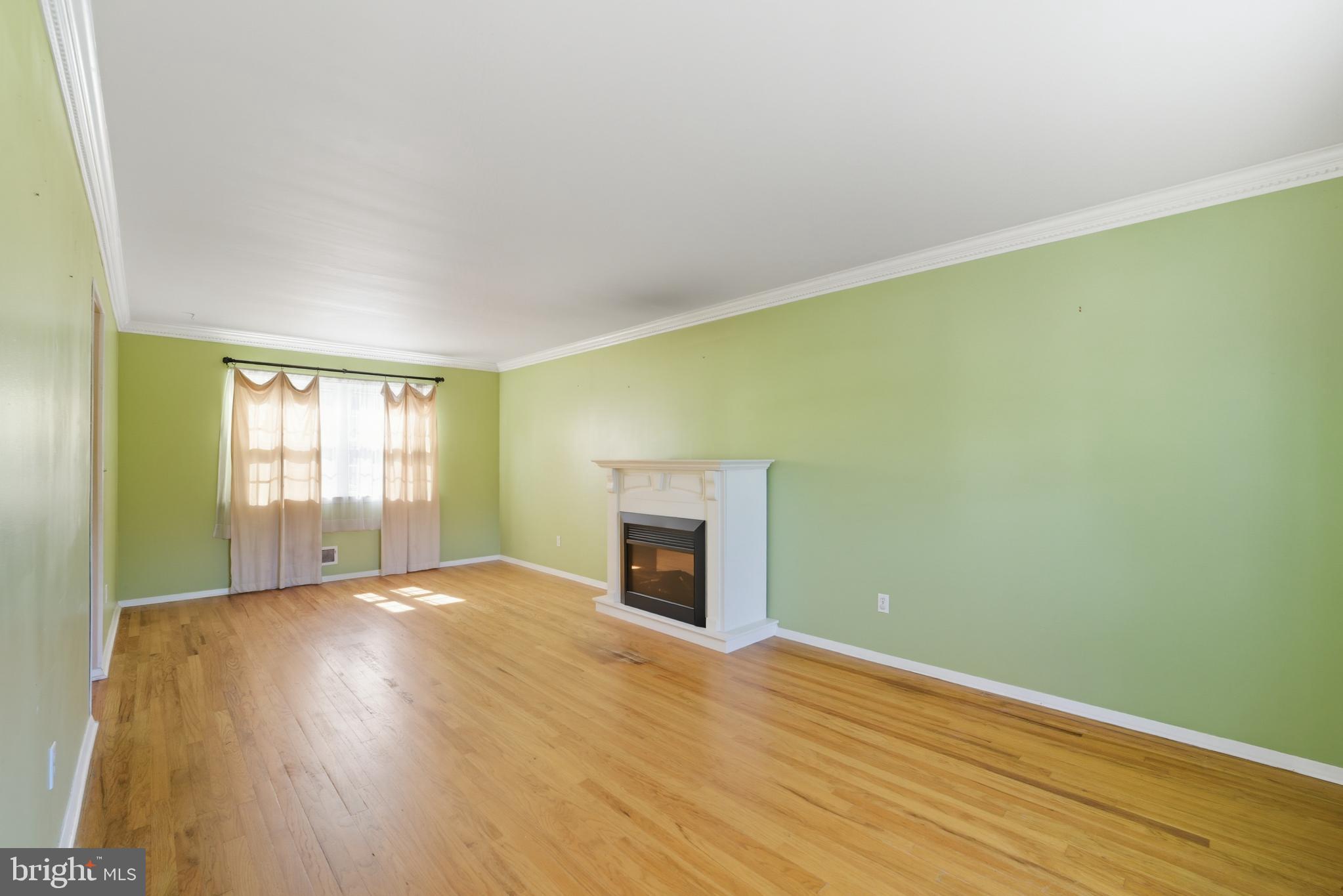 5 Corey Drive Ewing, NJ 08618 - Photo 8 of 30 a view of an empty room with wooden floor and a window
