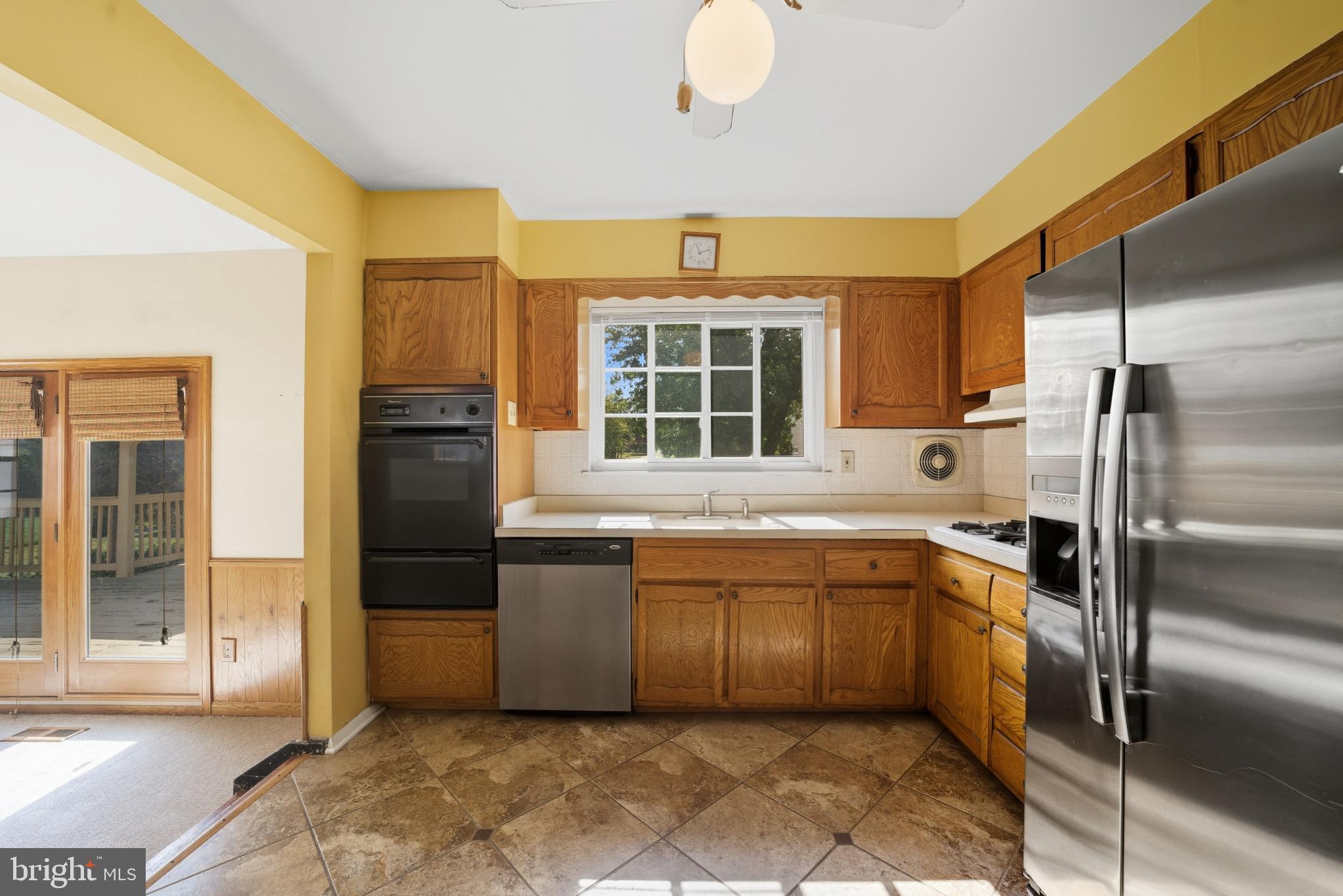 5 Corey Drive Ewing, NJ 08618 - Photo 9 of 30 a kitchen with stainless steel appliances granite countertop a refrigerator and a sink