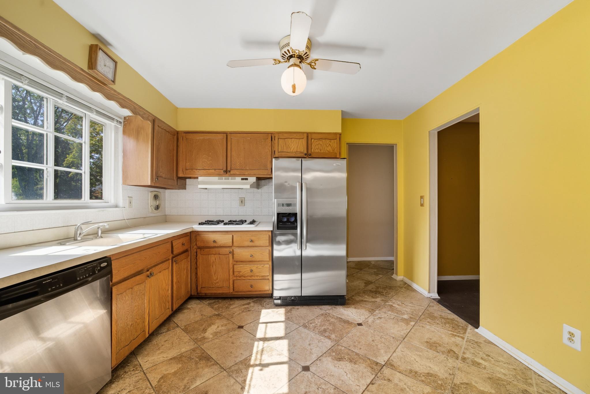 5 Corey Drive Ewing, NJ 08618 - Photo 10 of 30 a kitchen with stainless steel appliances granite countertop a sink and cabinets