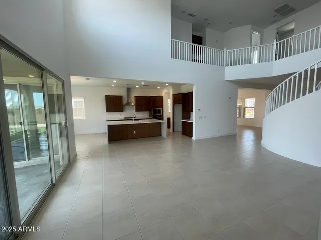 a view of living room with furniture and windows