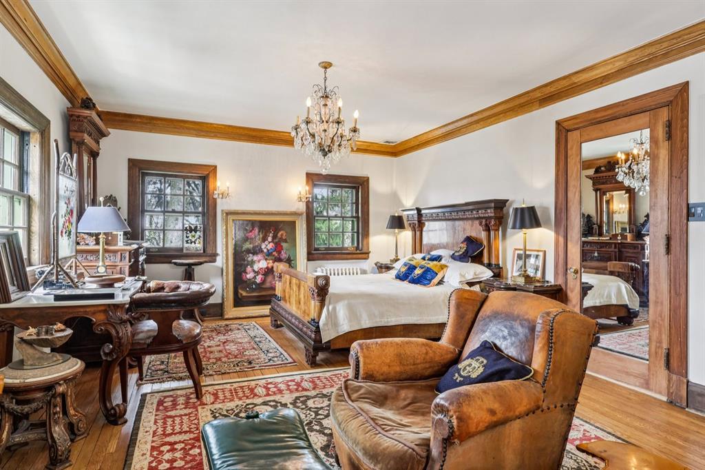 4352 Centre Avenue Pittsburgh, PA 15213 - Photo 21 of 45 a living room with fireplace furniture and a chandelier