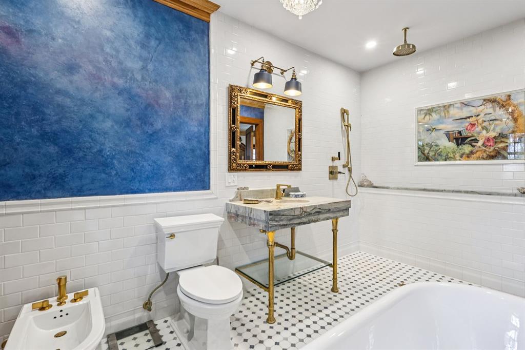 4352 Centre Avenue Pittsburgh, PA 15213 - Photo 24 of 45 a bathroom with a sink a toilet and mirror