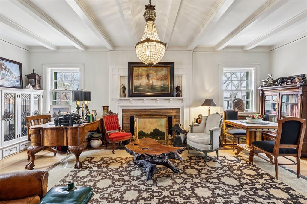 4352 Centre Avenue Pittsburgh, PA 15213 - Photo 6 of 45 a living room with furniture a fireplace and a flat screen tv