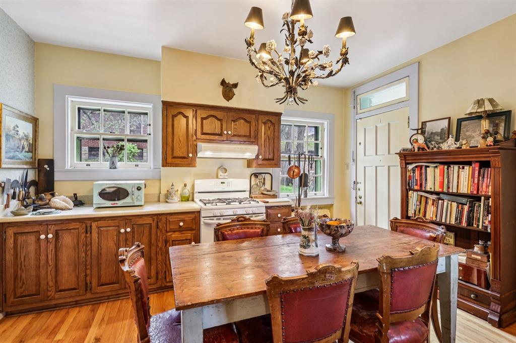 4352 Centre Avenue Pittsburgh, PA 15213 - Photo 9 of 45 a view of a dining room with furniture window and wooden floor
