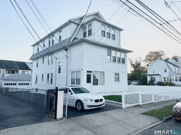 a car parked in front of a house