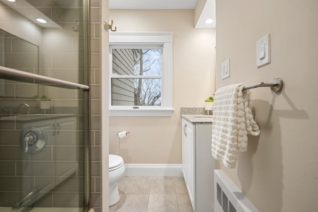 93 Wolcott Road Brookline, MA 02467 - Photo 14 of 41 a bathroom with a shower