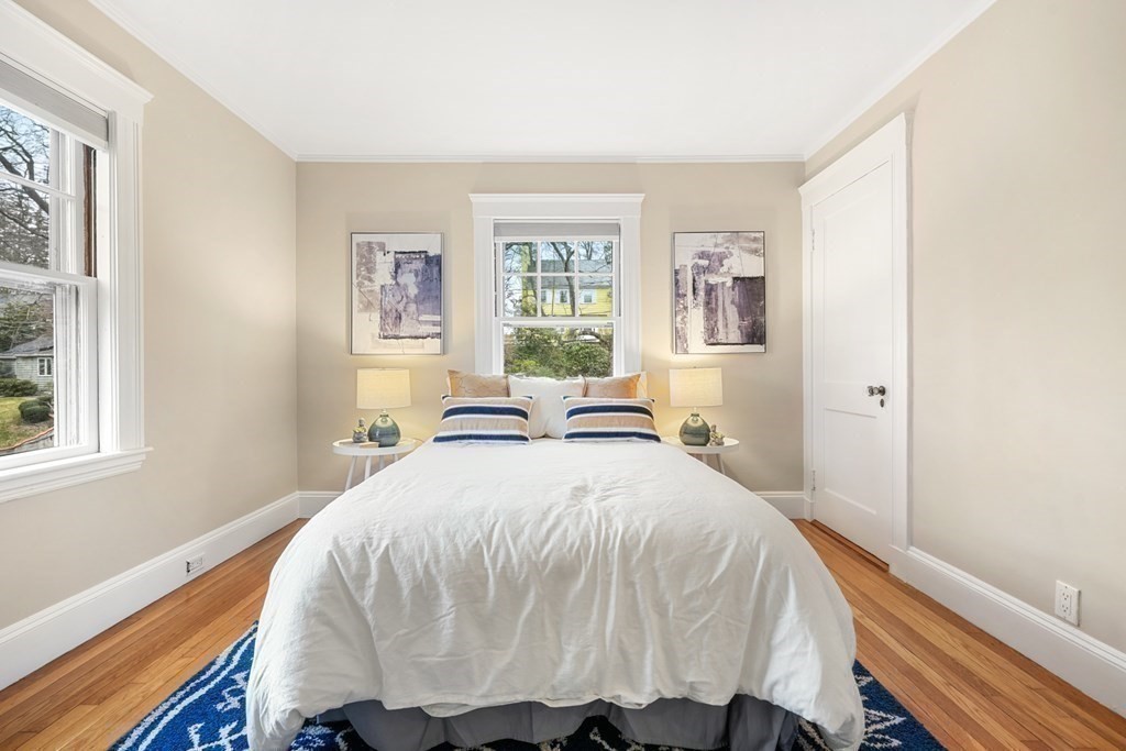 93 Wolcott Road Brookline, MA 02467 - Photo 21 of 41 a bed sitting in a bedroom next to a window