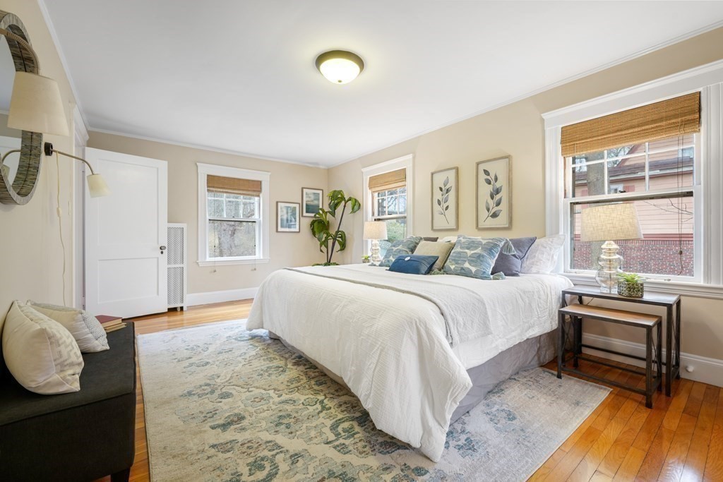 93 Wolcott Road Brookline, MA 02467 - Photo 23 of 41 a spacious bedroom with a bed and wooden floor