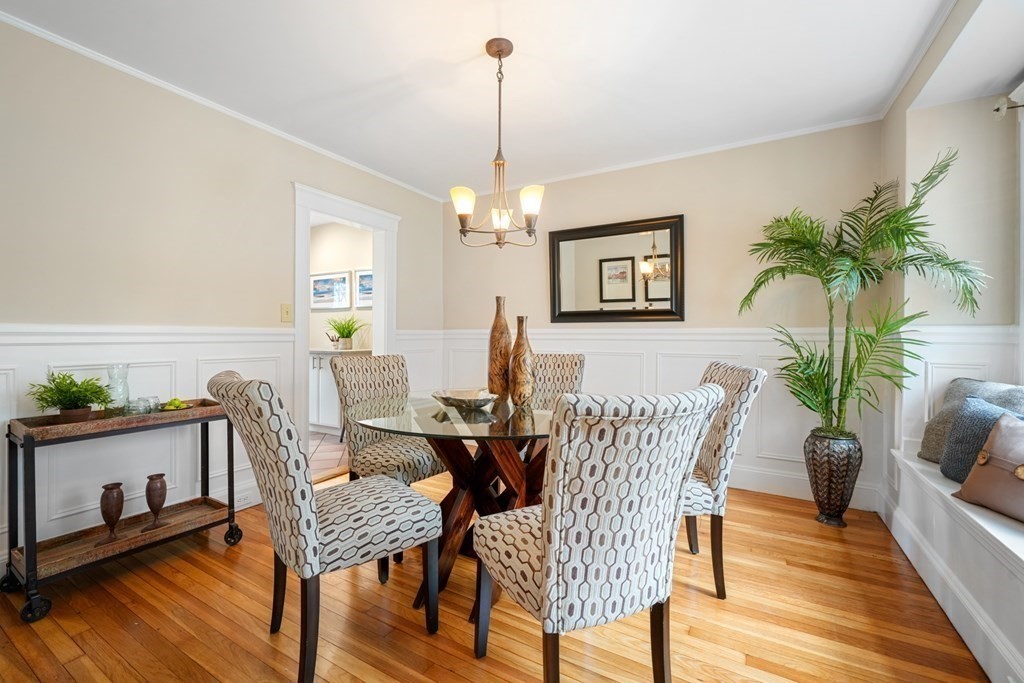 93 Wolcott Road Brookline, MA 02467 - Photo 8 of 41 a view of a dining room with furniture window and wooden floor