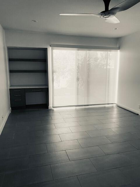1111 East Ramon Road, Unit 10 Palm Springs, CA 92264 - Photo 12 of 23 a view of an empty room with a window