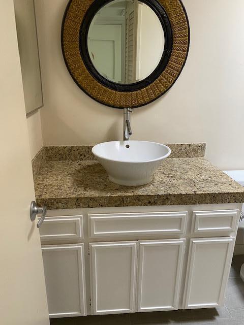 1111 East Ramon Road, Unit 10 Palm Springs, CA 92264 - Photo 14 of 23 a sink with a mirror