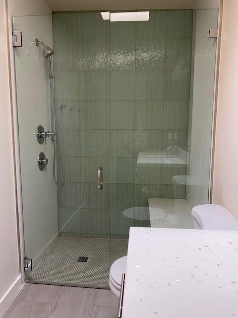 1111 East Ramon Road, Unit 10 Palm Springs, CA 92264 - Photo 15 of 23 a bathroom with a shower and toilet