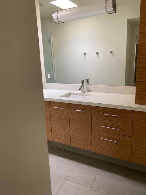1111 East Ramon Road, Unit 10 Palm Springs, CA 92264 - Photo 16 of 23 a bathroom with a sink and vanity